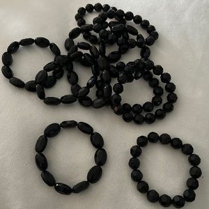 11 black beaded bracelets. All in perfect condition!